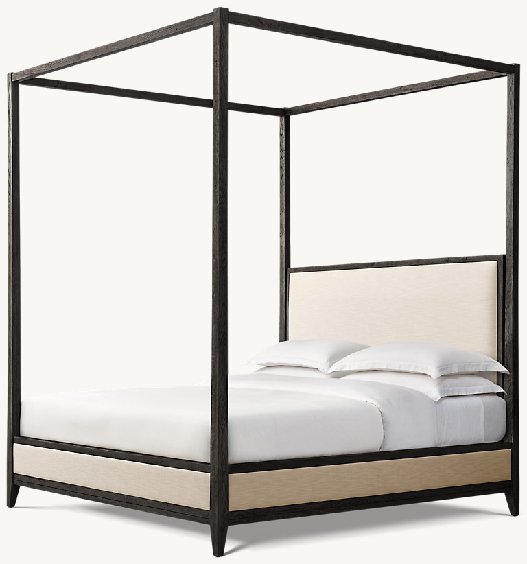 Detail view of Cayden Campaign Canopy Bed showing oak canopy bed design