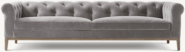 Detail view of Italia Chesterfield Sofa - Oak Base showing oak sofa design