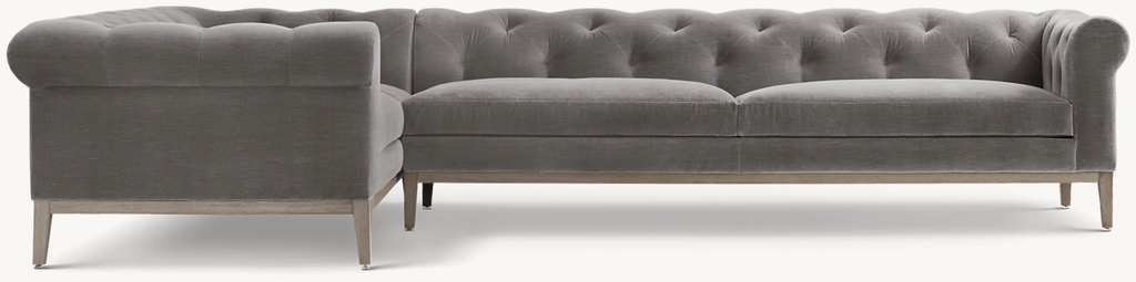 Detail view of Italia Chesterfield Customizable Sectional - Oak Base showing oak sectional design