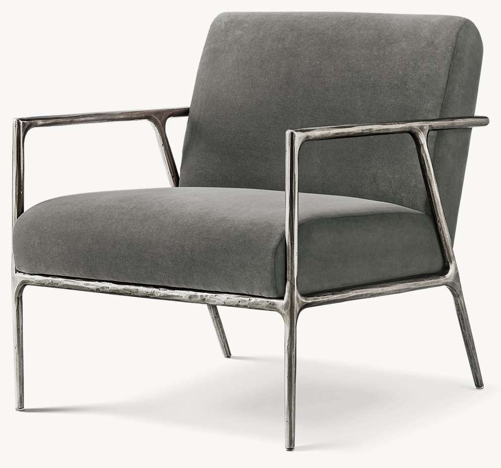 Detail view of Thaddeus Track Arm Chair showing iron armchair design